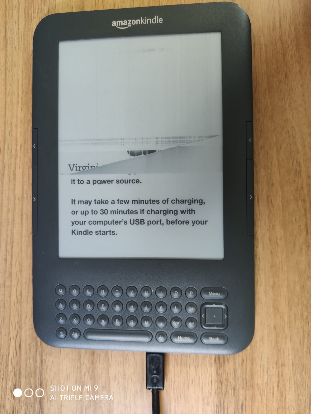 I have a Kindle keyboard (Model D00901). It will not turn on, despite being  on the charger for hours. I tried the hard reboot (sliding the power switch  and holding for 20+